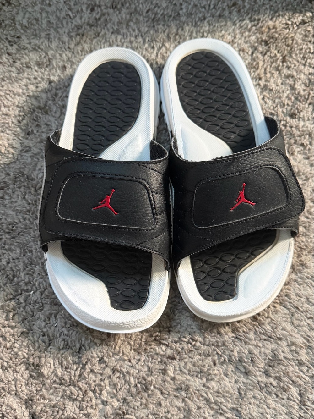 Jordan Black and White Slide Sandals with Red Jumpman Accent